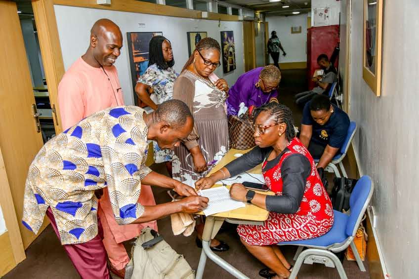 Delegates registering ahead of a training session