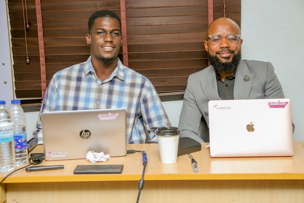 Facilitation team preparing session materials on laptops